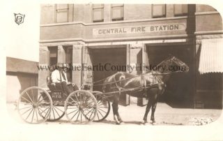 Fire Chief in horse drawn wagon in front of the Central Fire Station