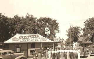 Oasis Drive In with employees standing in front of the building