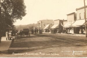 Then and Now Madison Lake Main Street Then with people and vehicles on the street