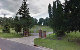 Glenwood Cemetery Street view of Entrance with some graves in the background