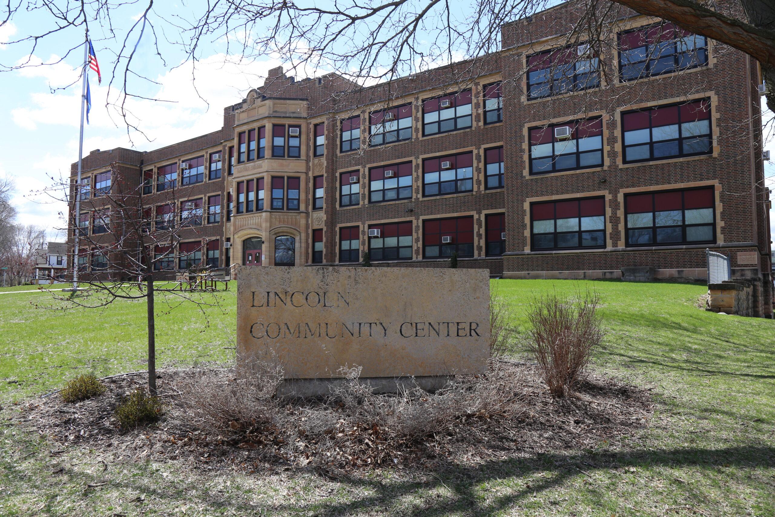 red brick building on a sunny day with a kasota stone sign saying Lincoln Community Center